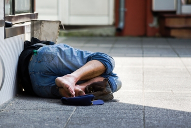 Picture of homeless man sleeping on street