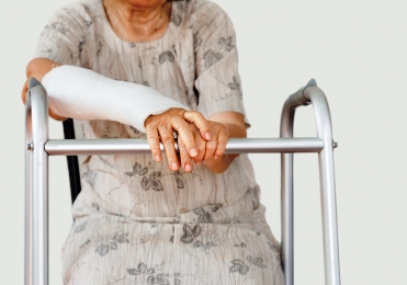 Older woman nursing a broken wrist
