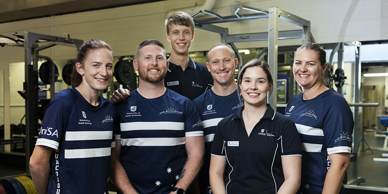 Bachelor of Exercise and Sport Science student Lachlan Darch (centre back) and Bachelor of Clinical Exercise Physiology (Hons) student Amber Cameron (second from right), with Invictus Pathways Program (IPP) participants Emilea Mysko, Steven Avery, Narelle Mason and Ash Muir.