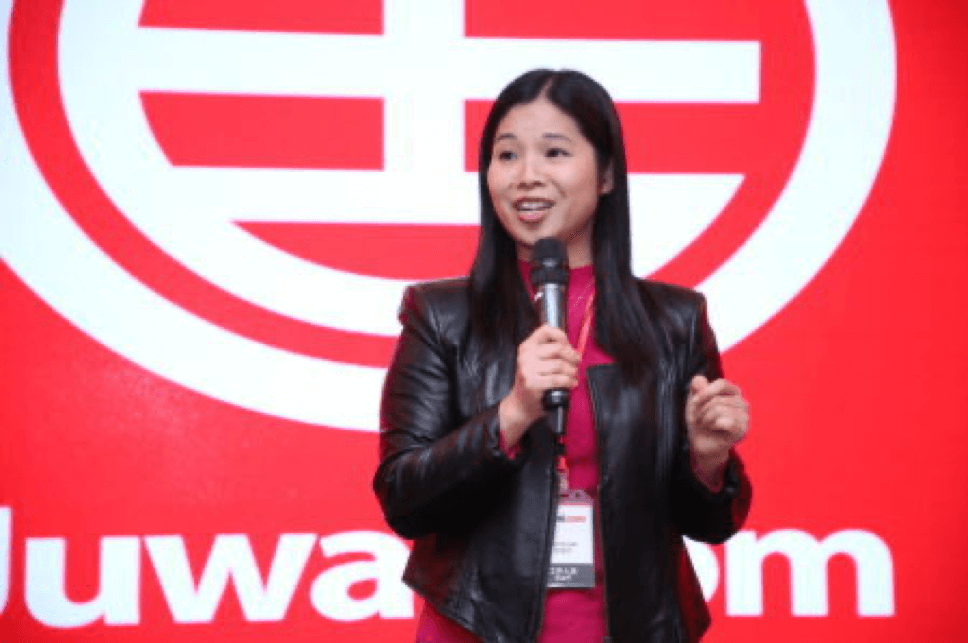 Carrie at a speaking engagement during her time as CEO of Juwai.com