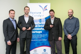 The teams from Vinnovate and Voxiebox in front of Venture Catalyst banner