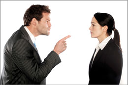 Employer pointing his finger in anger at employee