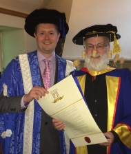 Sir Terry Pratchett recieving his Honorary Doctorate from the University of South Australia's Vice Chancellor Prof David Lloyd