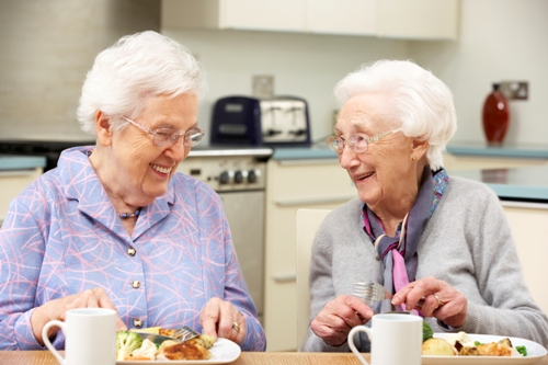 Elderly Ladies Enjoying A Meal