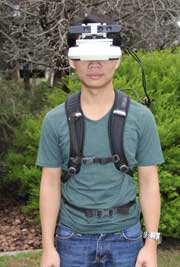 Thuong Hoang demonstrating the wearable computer.