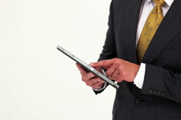 Man in suit holding HP tablet 