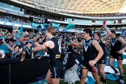 Port Adelaide Football Club players leave field after win