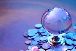 Globe surrounded by coins 