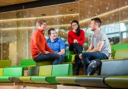 Students chatting inside modern building