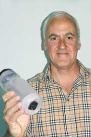 Sandy Walker with his invention, the Safety Bottle Light