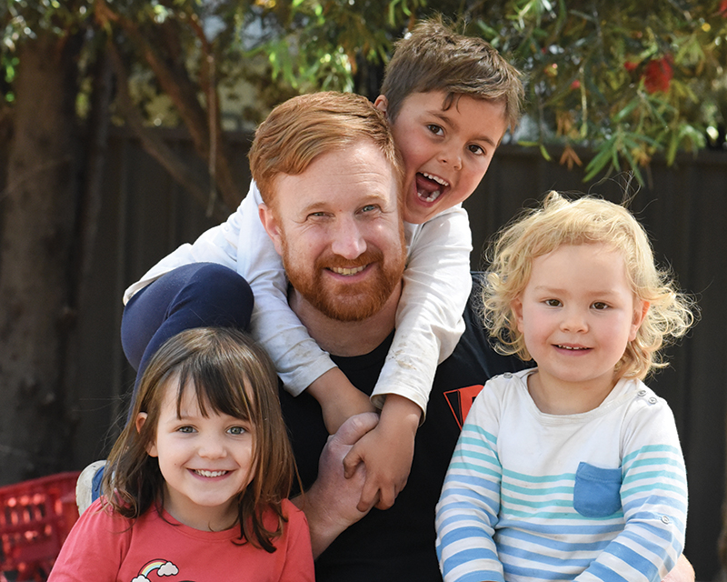 Early childhood teacher and UniSA graduate Rob Lister pictured with some of the children at Gowrie SA’s Underdale centre, where he works. Photo by Cath Leo.