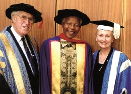 Nelson Mandela receives his Honorary Doctorate from former Chancellor Dr Basil Hetzel and former VC Prof Denise Bradley AO