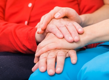 Hands placed in caring gesture