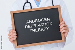 Man holding sign with androgen deprivation therapy written on it