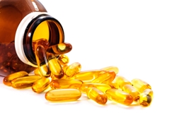 fish oil capsules coming out of vitamin bottle