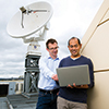 Associate Professor Gottfried Lechner and Research Engineer Hidayat Soetiyono analyse data from UniSA’s satellite tracking station.