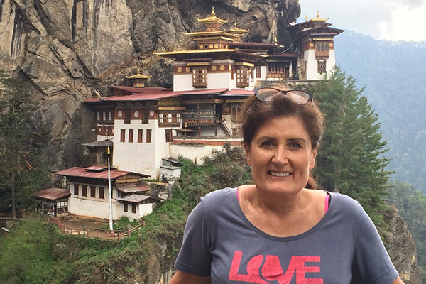 (Image: Suzanne in front of Taktsang Monastery, or the tiger's nest, in Paro, Bhutan)