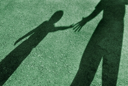 Shadows of a child and adult