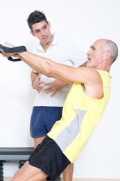 man doing strength training with personal trainer