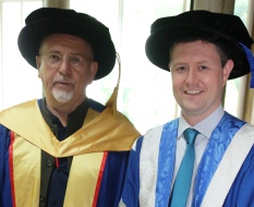 Co-founder of Womad and musician Peter Gabriel and UniSA Vice Chancellor Professor David Lloyd in graduation robes