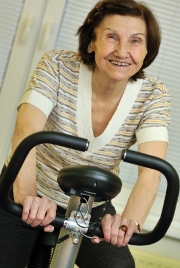 Elderly woman on exercise bike 