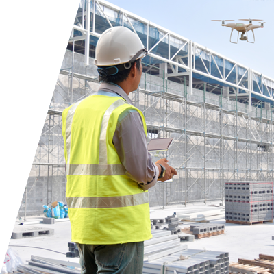Operator using a drone to inspect a construction site