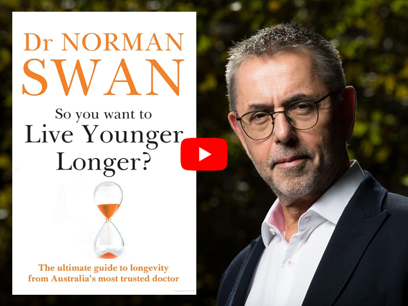 Dr Norman Swan next to the cover of his book 'So you want to Live Younger Longer?