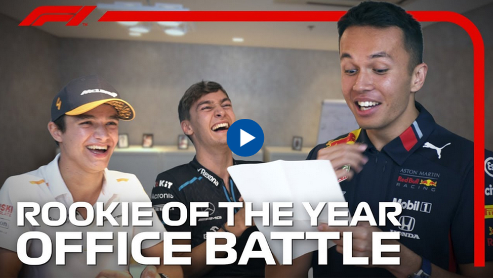 Formula 1 rookies laughing, text overlay: Rookie of the Year Office Battle
