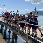 Pain revolution cyclists gathering for a photo on a jetty