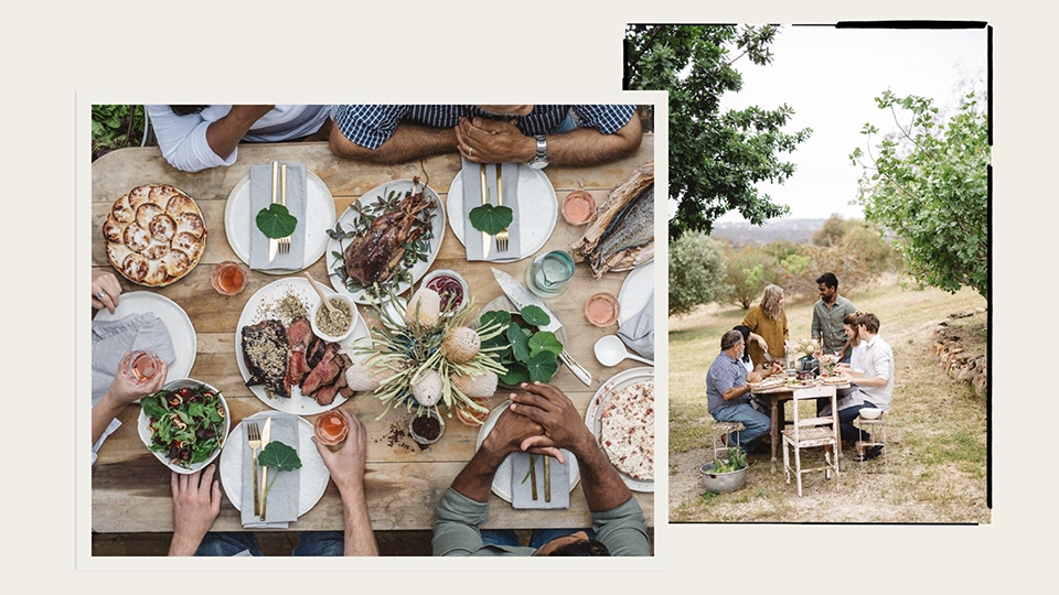 Table laid with roast meats, vegetables and salad