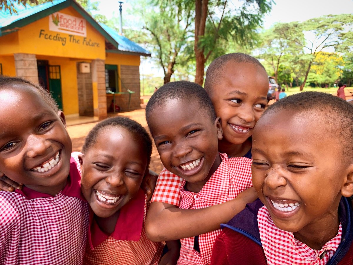 Children standing in front of the Food4Education outlet, Kenya