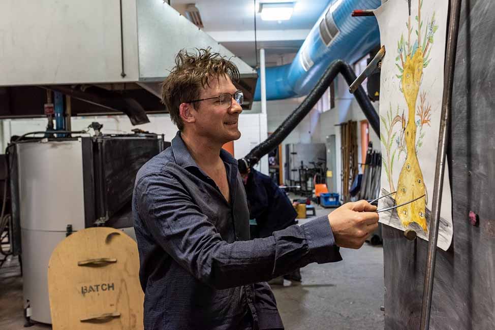 Tom Moore at work in his glass blowing studio