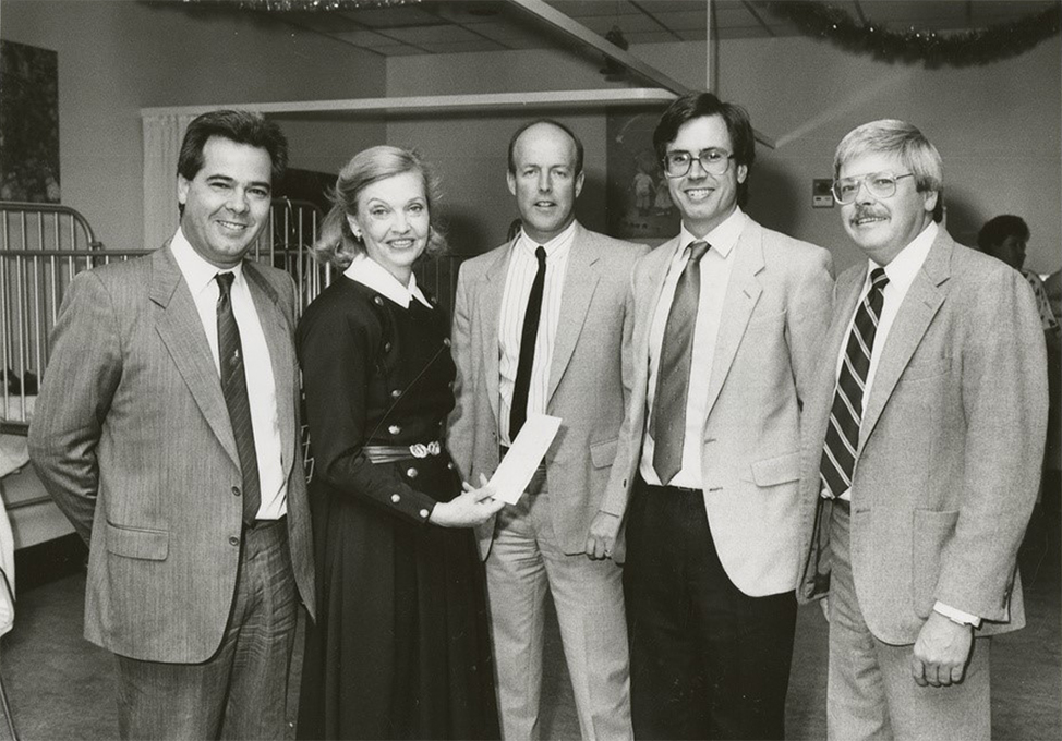 Beverley Perrett (second from left) receiving a cheque as the Adelaide Children's Hospital board chairman for the hospital’s Ride for Life fund. Source: State Library of South Australia. [B 70869/1586])