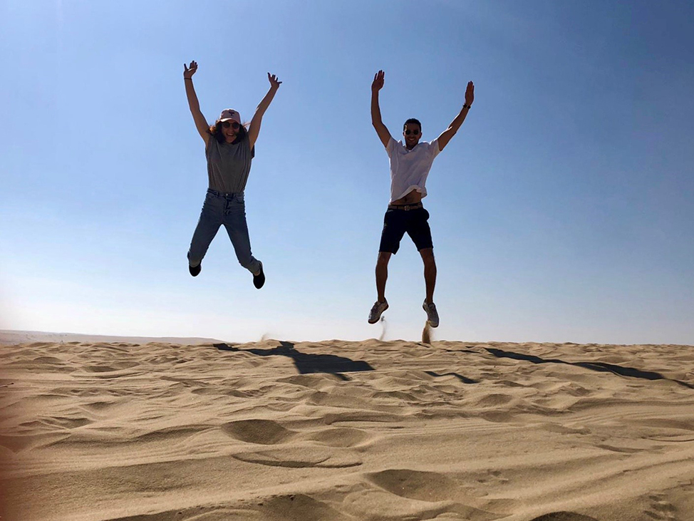 : Lauren (left) Exploring sand dunes in Doha, Qatar