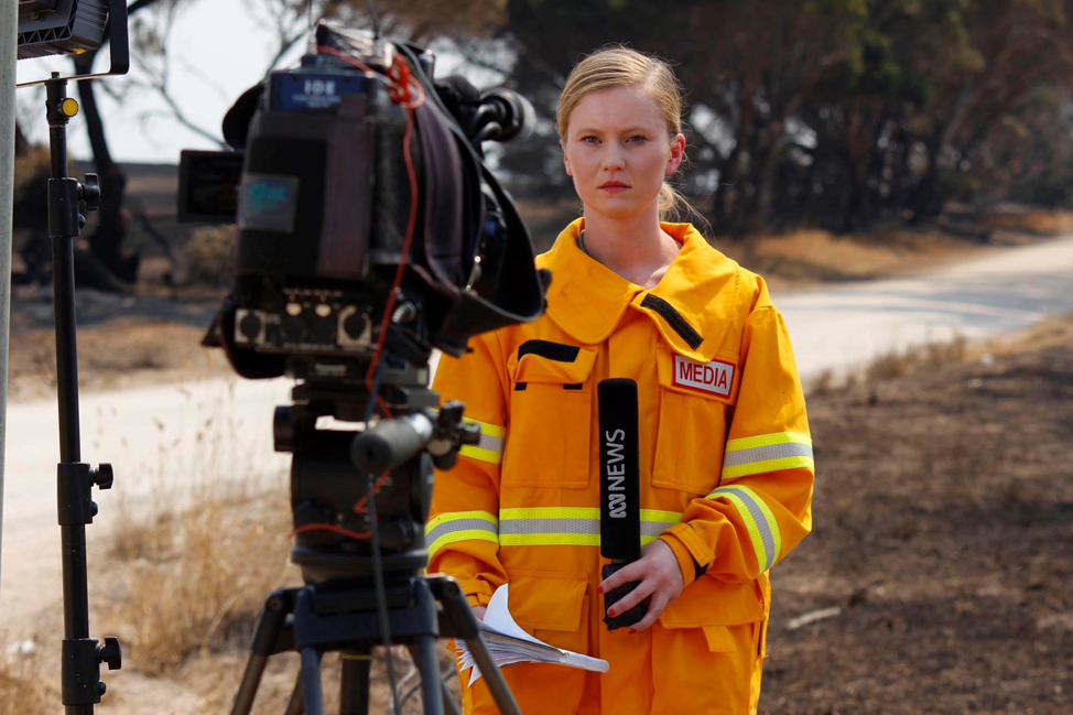 Brittany Evins on the job in protective fire apparel