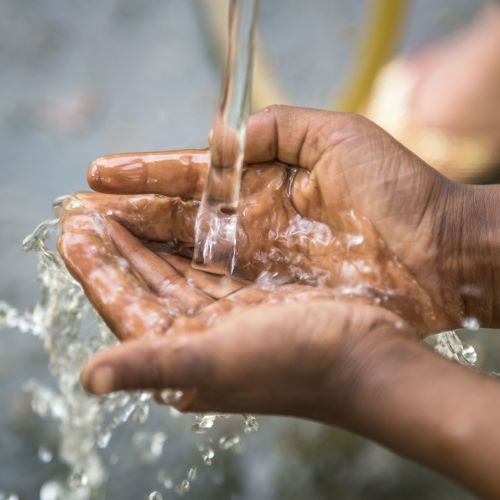 freshwater streaming into cupped hands.jpg