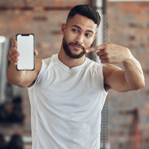 Young man posing in a gym