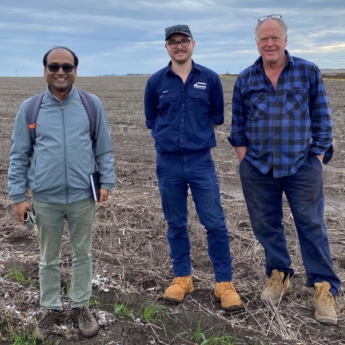 Group of men standing in a field