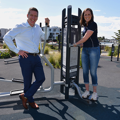 Dr Aly Crozier and Clinton Jury on fitness equipment