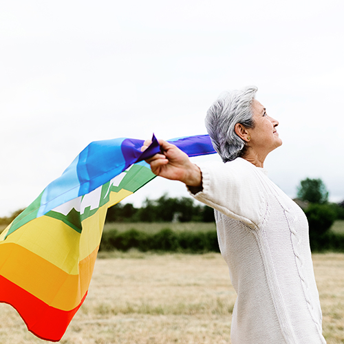 Older person with rainbow flag