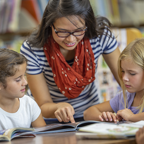 teacher reading with children