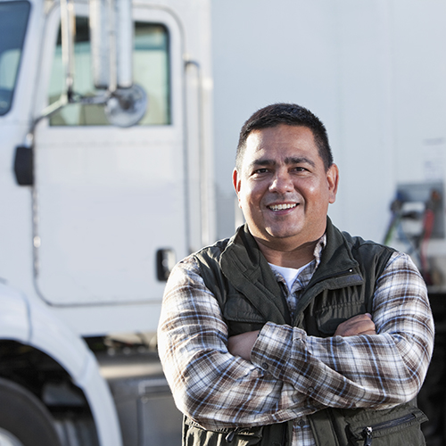 truck driver in front of truck