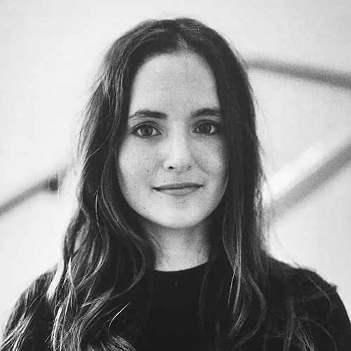 Black and white portrait of Pilar Mata Dupont, a Caucasian female with wavy, long, dark hair wearing a dark coloured t-shirt.jpg
