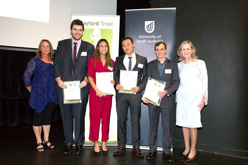 Dr Kate Delaporte from the Playford Trust and UniSA Pro Vice Chancellor: Student Engagement & Equity (right) Professor Carol Grech with UniSA Playford Trust Honours Scholarships recipients Jacob Dalgleish, Cintya Dhamayanti, Andrew Du and Anthony Randell. Photo courtesy Jo-Anna Robinson