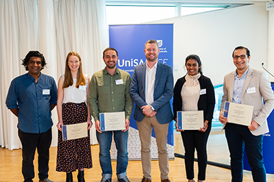 UniSA’s Vice Chancellor and President’s Scholarship recipients Yusuf Hayat, Ashleigh Hull, Mehmet Yildiz, Chamitha Wijewickrama, Mahmoud Khedher receive their awards from Vice Chancellor Prof David Lloyd (pictured centre).