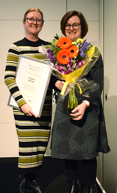 Professor Stacey George presents Dr Angela Berndt (L) with Occupational Therapy Australia’s Lifetime Achievement Award.
