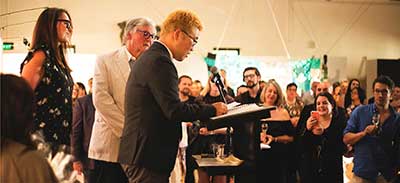 Jonathan Kim giving his acceptance speech with David McKee AO and Kirsty Roderick. Photo by Georgia Matthews.