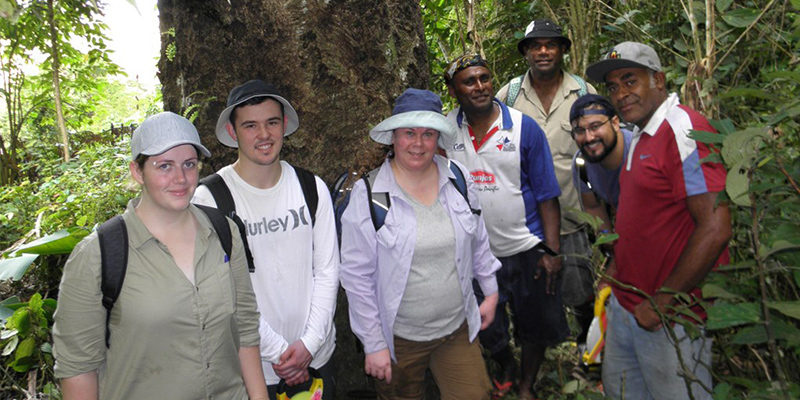 The ma tree survey team comprised of UniSA students, Abaca villagers and NatureFiji-MareqetiViti staff in front of a large ma tree. Photo: Gunnar Keppel.