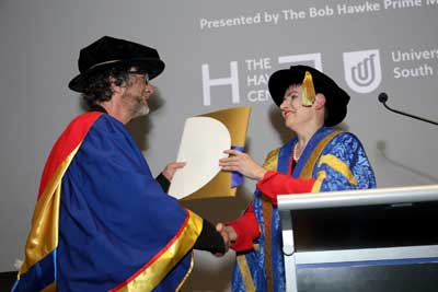 UniSA Chancellor Pauline Carr presenting Neil Gaiman with an Honorary Doctorate.