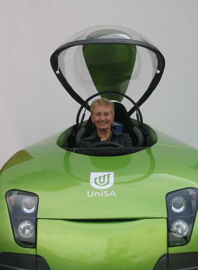 Denise Bradley sitting in UniSA's electric car, Trev.